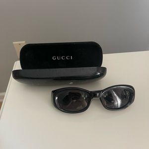 Gucci sunglasses black with case; great condition; slim oval sunglasses
